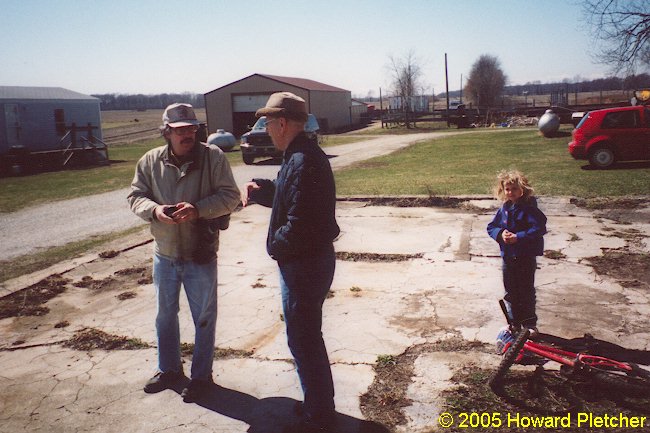 The gentleman in the center is the current owner of the property on which the Wilkinson Station and substation remains are located.  The pole barn beyond him in the center of the photo sits directly on the Air Line right-of-way.  Howard Pletcher